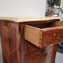 Stunning French seven drawer Kingwood and marquetry inlaid semainier with a beautiful marble top. In good original detailed condition.