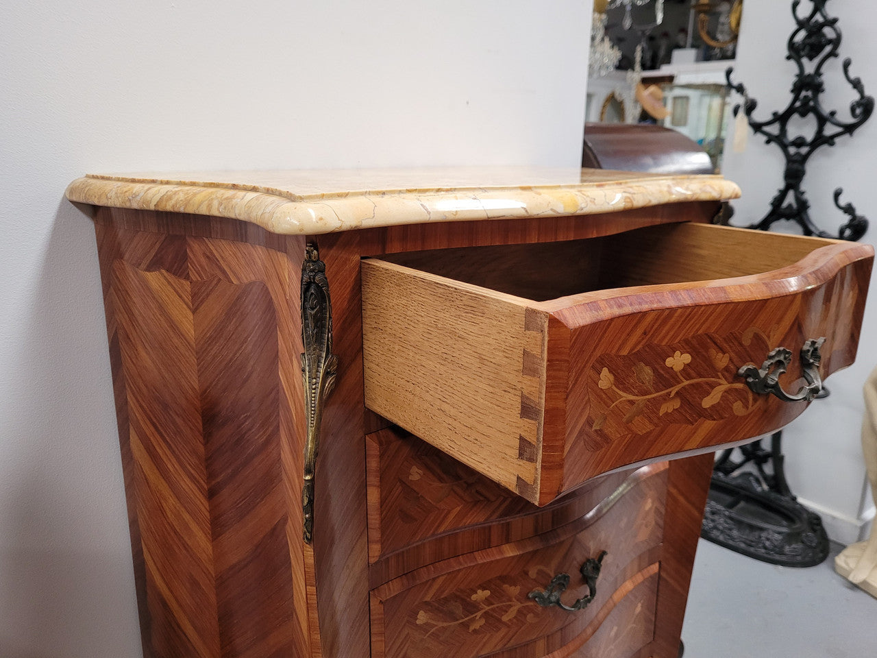 Stunning French seven drawer Kingwood and marquetry inlaid semainier with a beautiful marble top. In good original detailed condition.