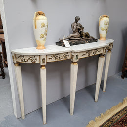 French Louis XVI style painted marble top console table. It is of pleasing narrow proportions and has been sourced from France. It is in good original detailed condition.