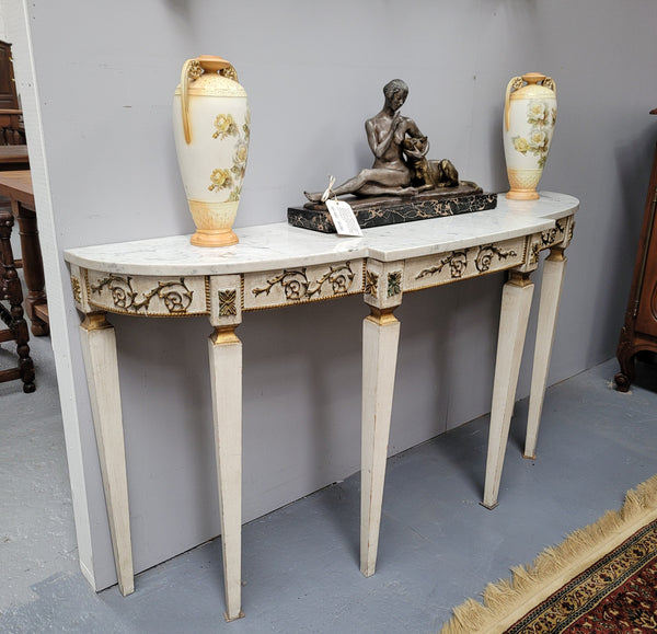 French Louis XVI style painted marble top console table. It is of pleasing narrow proportions and has been sourced from France. It is in good original detailed condition.