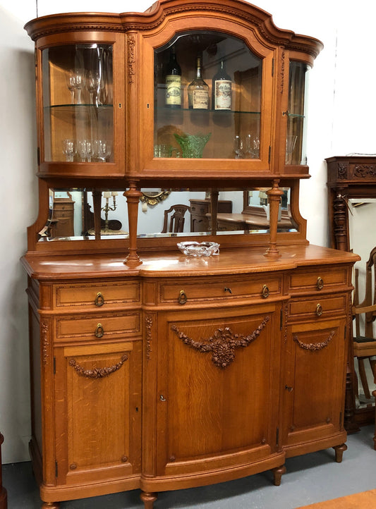 French Oak parquetry top sideboard with a glass top section for displaying and three cupboards and drawers for all your storage needs. Lovely carved details and is in good original detailed condition.