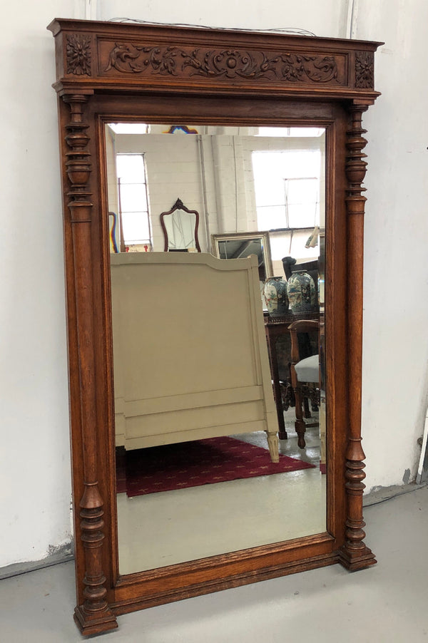 Beautifully carved French Henry II style Oak mantle mirror. Contains original glass and is in very good original detailed condition.