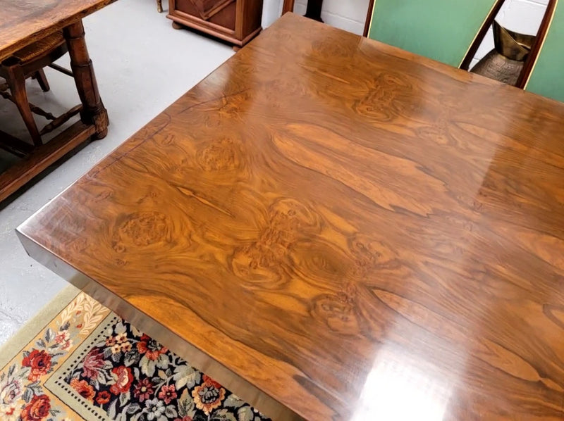 French Art Deco Figured Walnut dining table and six chairs. This stylish table also comes with a glass top and can be used with or without it. The chairs are very comfortable and the table can also fit another two chairs at either end making it a 6-8 seater. The table is in good original detailed condition with character marks to the top of table as shown in the pictures. This table and six chairs have been sourced locally.