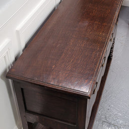 Rare size 19th Century English oak dresser base. It has two good size drawers and amazing patina. It has been sourced from France and in good original detailed condition.