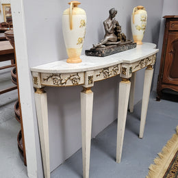French Louis XVI style painted marble top console table. It is of pleasing narrow proportions and has been sourced from France. It is in good original detailed condition.