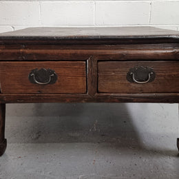 Square Elm coffee table with oriental legs and two long drawers.  Beautifully finished and in good original condition. It has been sourced from France.