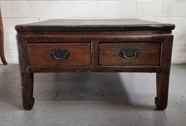 Square Elm coffee table with oriental legs and two long drawers.  Beautifully finished and in good original condition. It has been sourced from France.