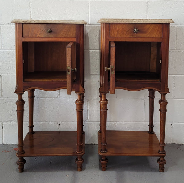 Pair of Louis XVI style walnut bedsides with attractive marble. They have one drawer, one cupboard and are in good original detailed condition.