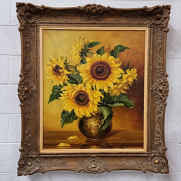 French signed oil on canvas depicting sunflowers in an attractive gilt frame. It is in good original detailed condition and has been sourced from France.