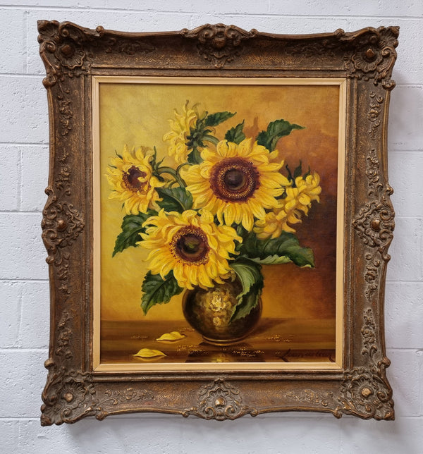 French signed oil on canvas depicting sunflowers in an attractive gilt frame. It is in good original detailed condition and has been sourced from France.