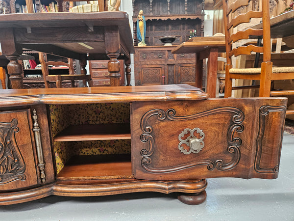 Appealing French Louis XVth style walnut converted TV unit.  Central carved  door & 2 Sliding Cupboards. In good condition.