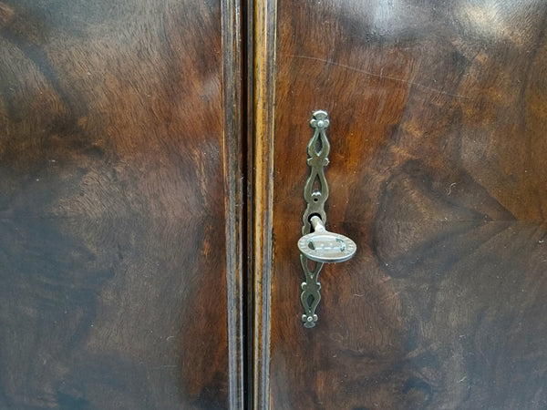 Amazing French Walnut Art deco four door buffet. The doors either side open to a fixed shelf and plenty of added storage with four drawers. In good original detailed condition.