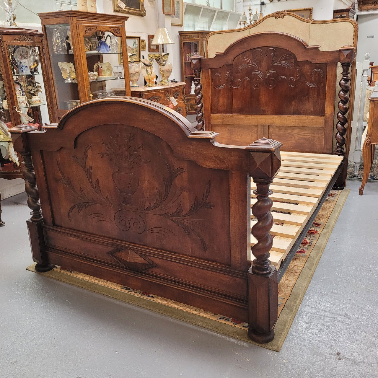 French 19th Century Walnut Henry II style queen sized bed with Barley Twist posts. Bed comes complete with custom made slats. Just place your mattress on top. In good original detailed condition.