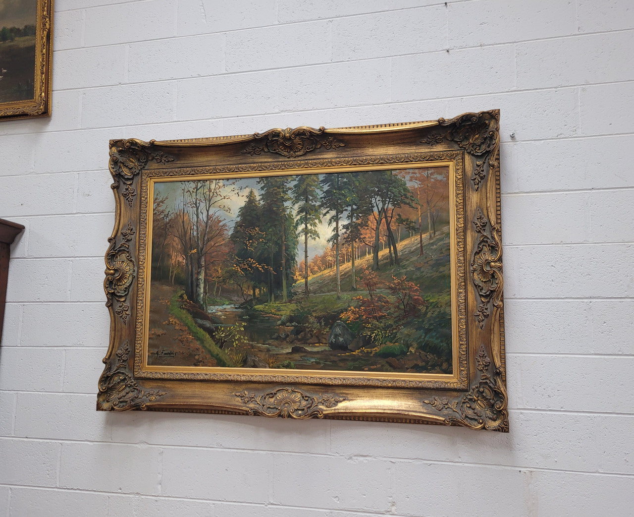 Large signed oil on canvas depicting a river stream in autumn framed in a stunning gilt frame. Sourced from France and is in good original detailed condition.