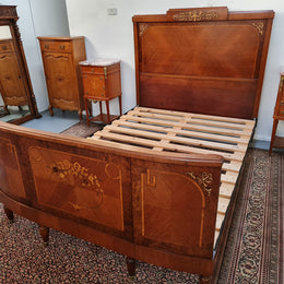 A high quality French Louis XV style bow fronted Queen size bed with marquetry inlay and ormolu mounts. In good original detailed condition. Circa: 1920