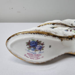 A lovely pair of Royal Albert China shoes in good original condition. Stamped on the sole 'Moonlight Rose: Royal Albert Bone China, England ©1987.