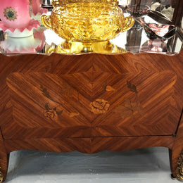 A Louis XV style Kingwood vitrine with marble top. It has beautifully floral inlay with ormolu mounts.