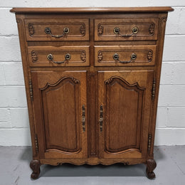 French Oak Louis XV style side cabinet. It has three drawers in total, two small drawers and one deep drawer. In good original detailed condition.