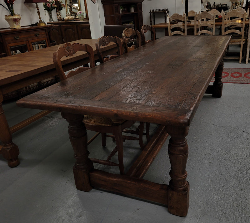 Amazing 2.65 meter French Elm Refectory dining table with loads of rustic charm. This table has been sourced from France and can comfortably seat ten people. It is in good original detailed condition.