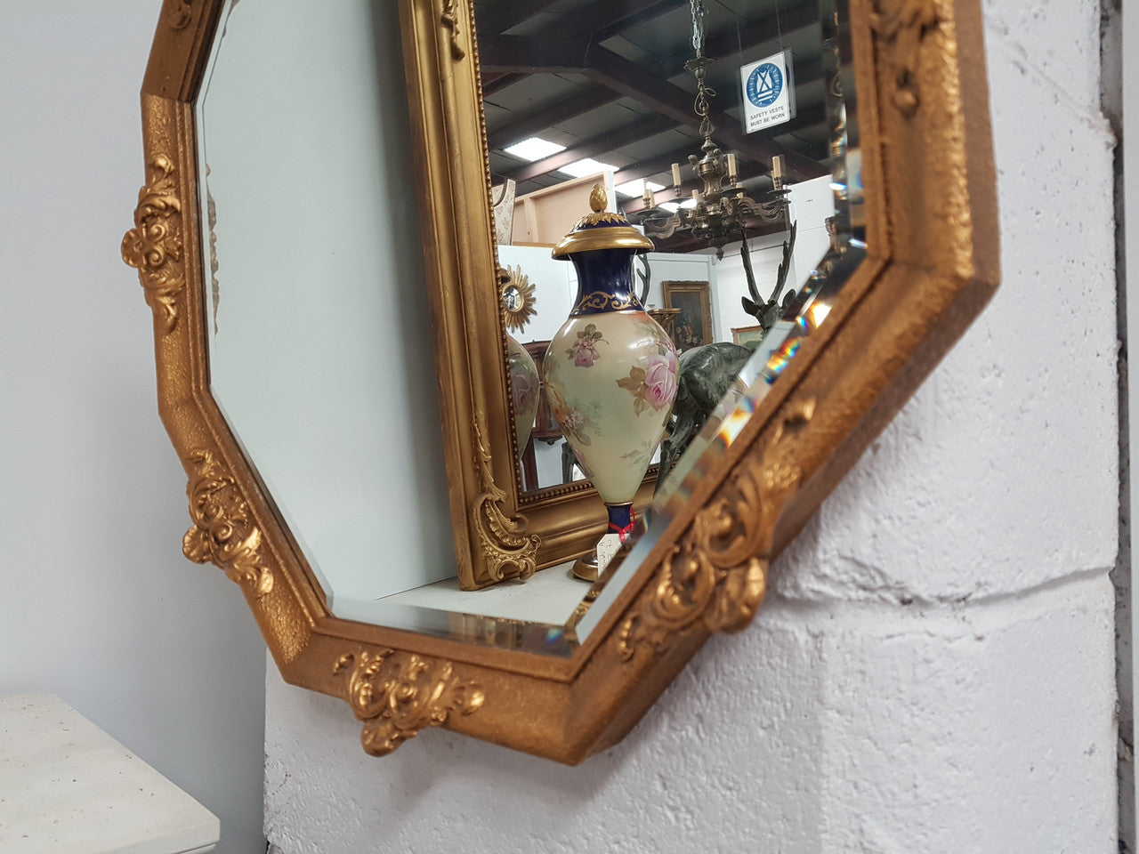 A beautiful Vintage octagon shape ornate gilt mirror, with bevelled glass and in good original condition.