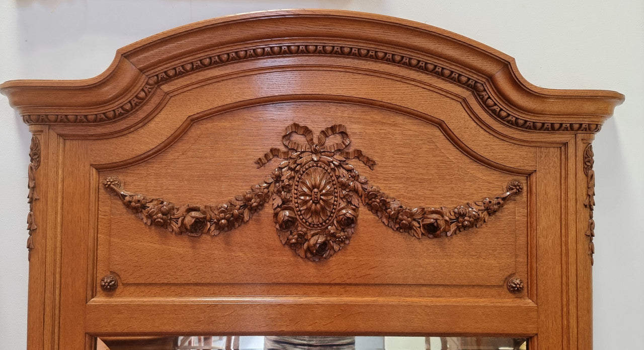 Beautiful French Oak Louis XV style carved trumeau mirror with beautiful detail. In good original detailed condition.