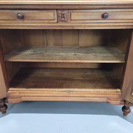 Stunning French walnut Henry II style marble top side cabinet with two drawers and two shelves inside. In good original detailed condition.