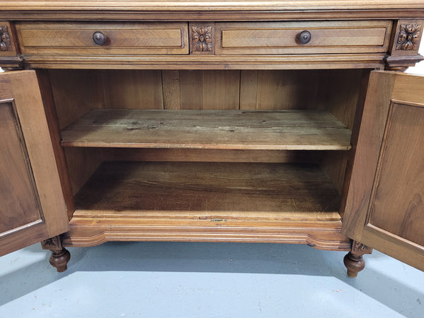 Stunning French walnut Henry II style marble top side cabinet with two drawers and two shelves inside. In good original detailed condition.