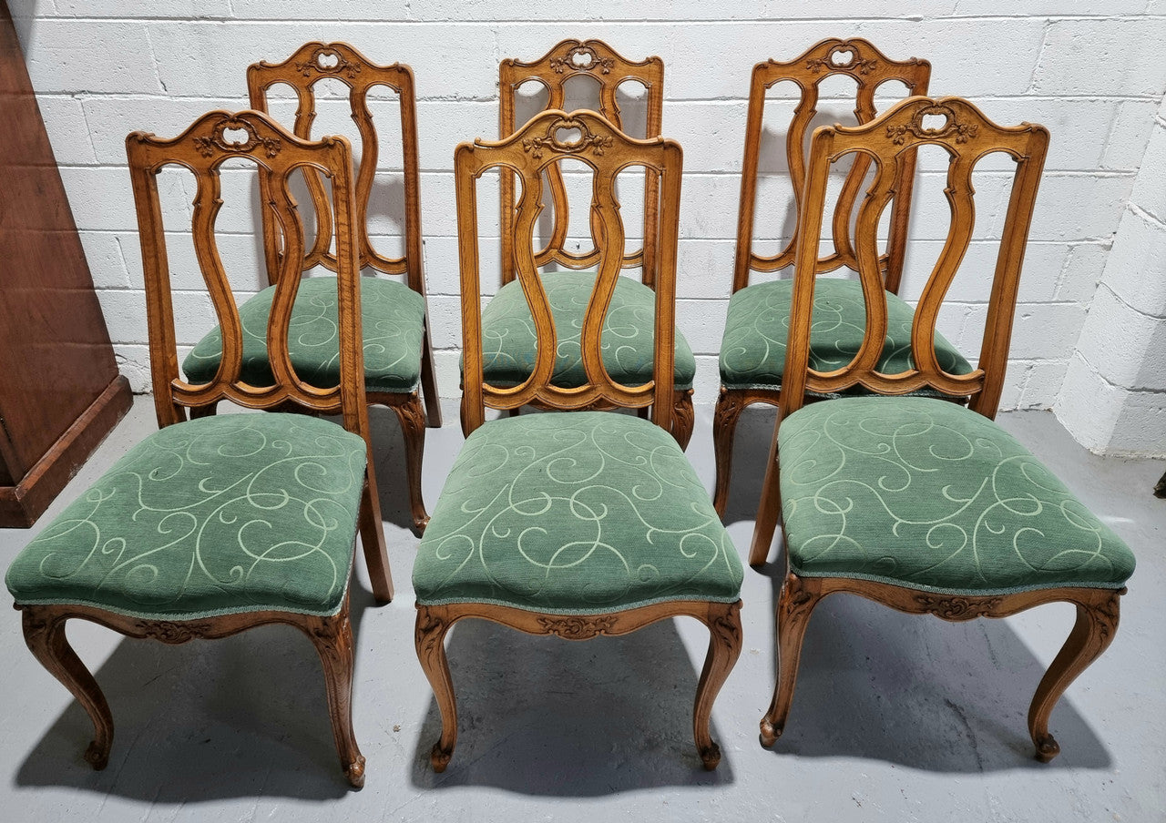 Set of six French style Oak decorative upholstered seat dining chairs. They are comfortable to sit in and are in good original condition, please view photos of fabric as the fabric is in good used condition.