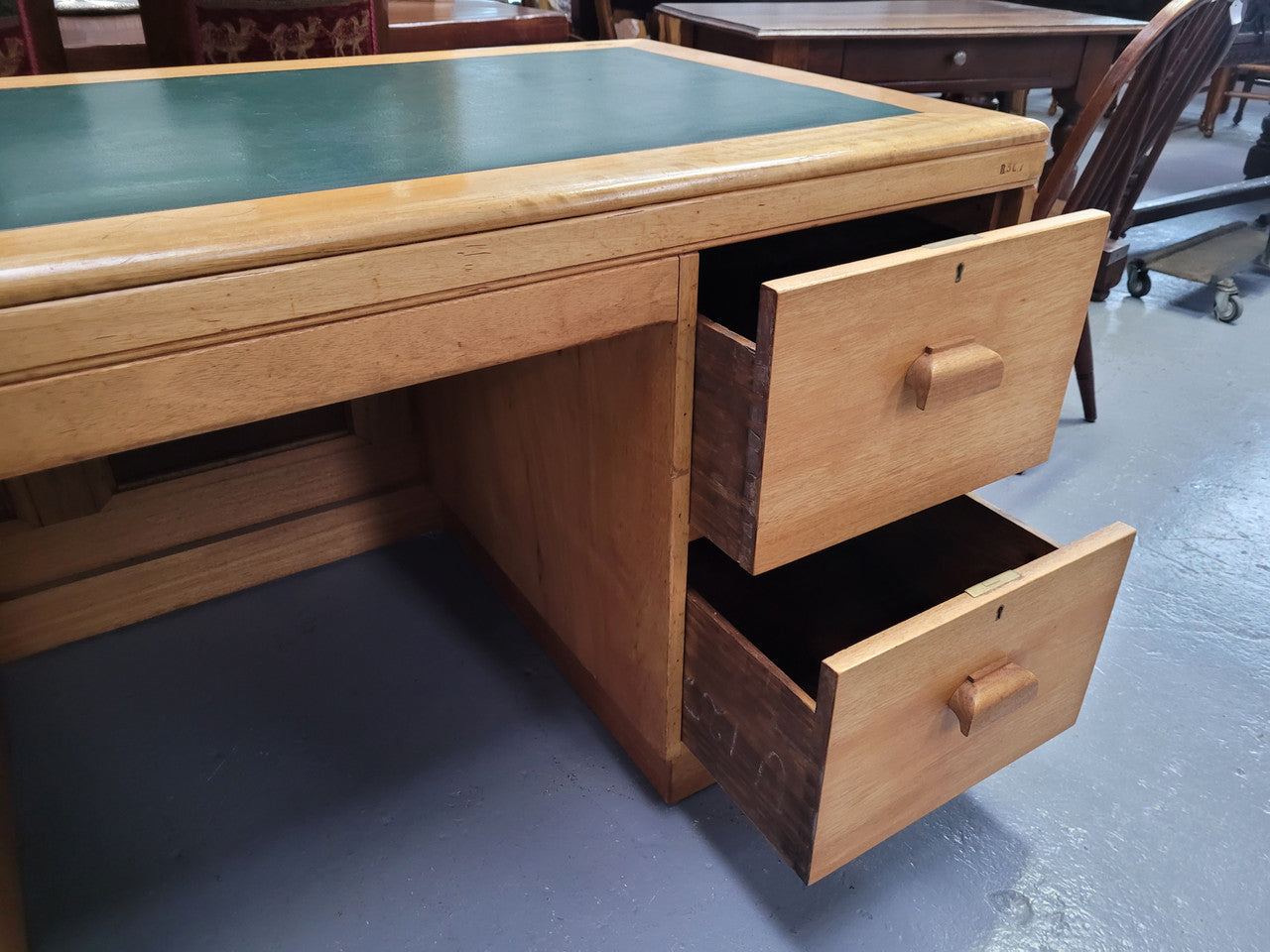 Parliament house desk made from Queensland maple. Desk has room numbers stamped to front. It's in good original condition. Purchased from a sale in old Parliament House in the late 1980's.