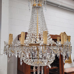 Fine French Empire basket shaped crystal chandelier. Consisting of ten exterior arms and four interior lights. It has stunning crystal's with prism drops. It has been sourced from France fully rewired to Australian standards.