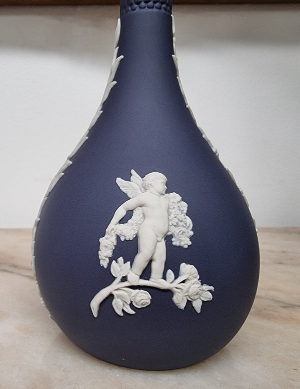 Wedgwood blue and white Jasper Ware bud vase. It is in good original condition with no chips or cracks, please view photos as they help form part of the description.