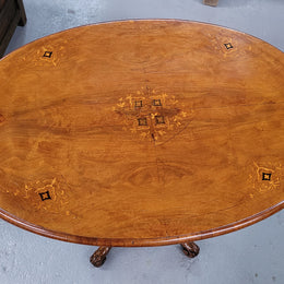 Victorian Walnut oval beautifully inlaid occasional table with bird cage undercarriage. It is in good original detailed condition and it has been sourced locally.