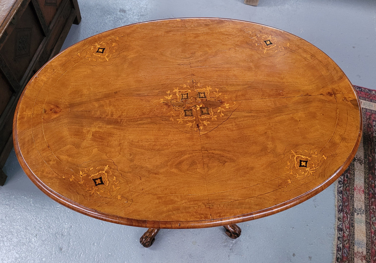 Victorian Walnut oval beautifully inlaid occasional table with bird cage undercarriage. It is in good original detailed condition and it has been sourced locally.