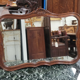 French Louis XV style carved Oak wall mirror. It is in good original detailed condition and has been sourced from France.