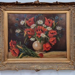 Lovely French signed floral oil on canvas of beautiful Poppies and Daisies in a ornate decorative frame. In good original condition.