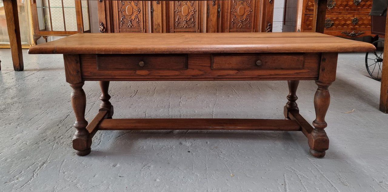 Fabulous Rustic French Oak coffee table with two drawers. It is in good original detailed condition.