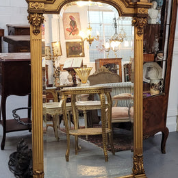 French Louis XVI style Napoleon III (1870’s) gilt mantle mirror. Beautifully carved and decorated with original bevelled mirror showing signs of age. It is in good original detailed condition and has been sourced from France.