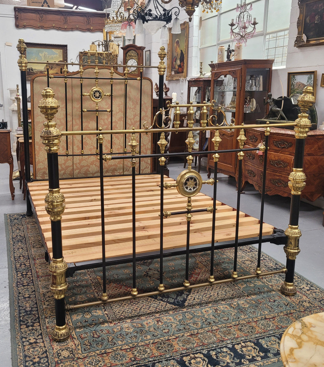 Rare Antique cast iron and brass Victorian queen size bed. Comes with custom made slats.  It has been sourced locally and is in good original condition.