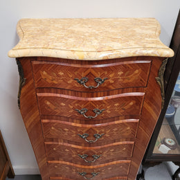 Stunning French seven drawer Kingwood and marquetry inlaid semainier with a beautiful marble top. In good original detailed condition.