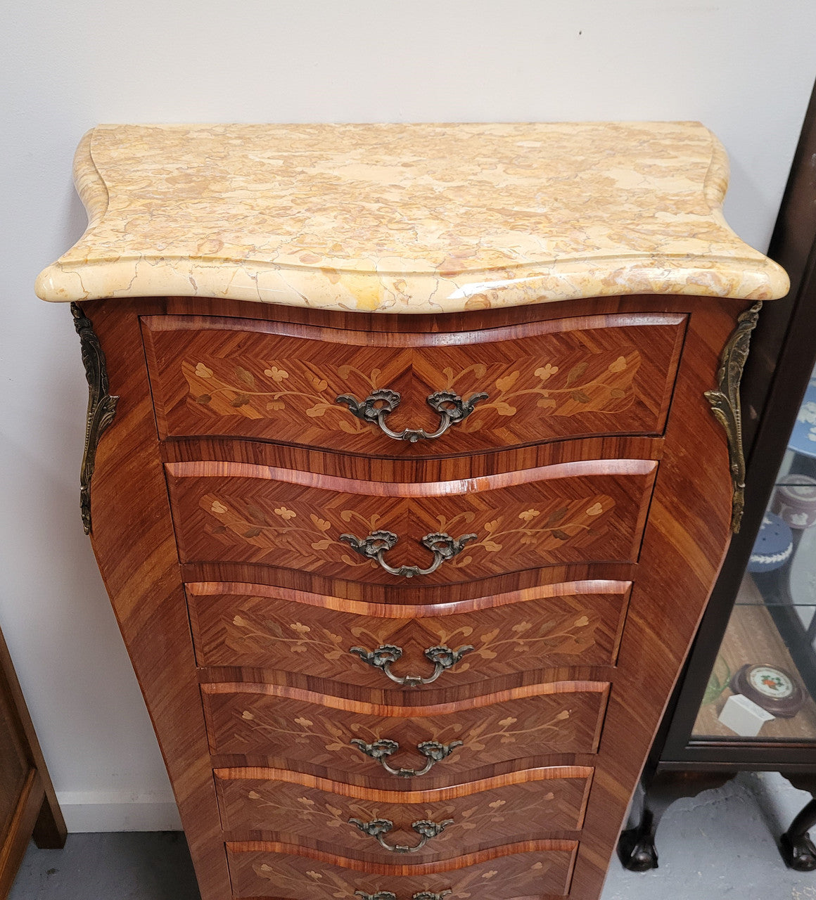 Stunning French seven drawer Kingwood and marquetry inlaid semainier with a beautiful marble top. In good original detailed condition.