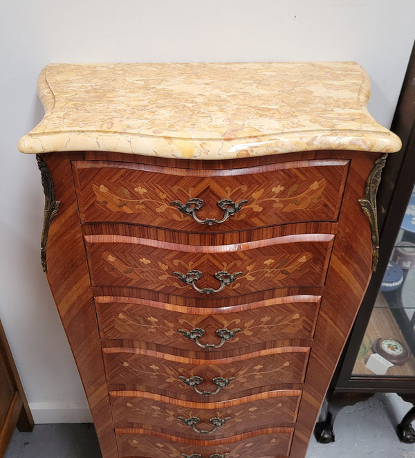 Stunning French seven drawer Kingwood and marquetry inlaid semainier with a beautiful marble top. In good original detailed condition.