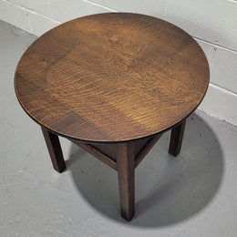 Fabulous round oak side table which also has a hidden sewing box underneath with lovely original blue satin lining and Includes pictured sewing items. It is in good original condition.