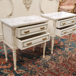 Attractive pair of Vintage French Louis 16th style two drawer marble topped bedsides. They have been sourced from France and are in good original condition.