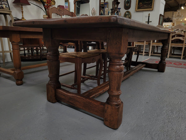 Amazing 2.65 meter French Elm Refectory dining table with loads of rustic charm. This table has been sourced from France and can comfortably seat ten people. It is in good original detailed condition.