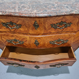 Attractive French marble top Louis XV style three drawer commode with decorative ormolu mounts. In good original detailed condition.