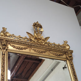 Impressive French Napoleon III water gilded mantle mirror. It is beautifully decorated with allegorical themes and has been sourced from France. In good original detailed condition with original mirror.