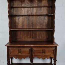 Rustic French Oak three shelf and two drawer kitchen dresser of pleasing small protions. Comes apart into two pieces for transport making it ideal for an apartment or unit. In very good original detailed condition.