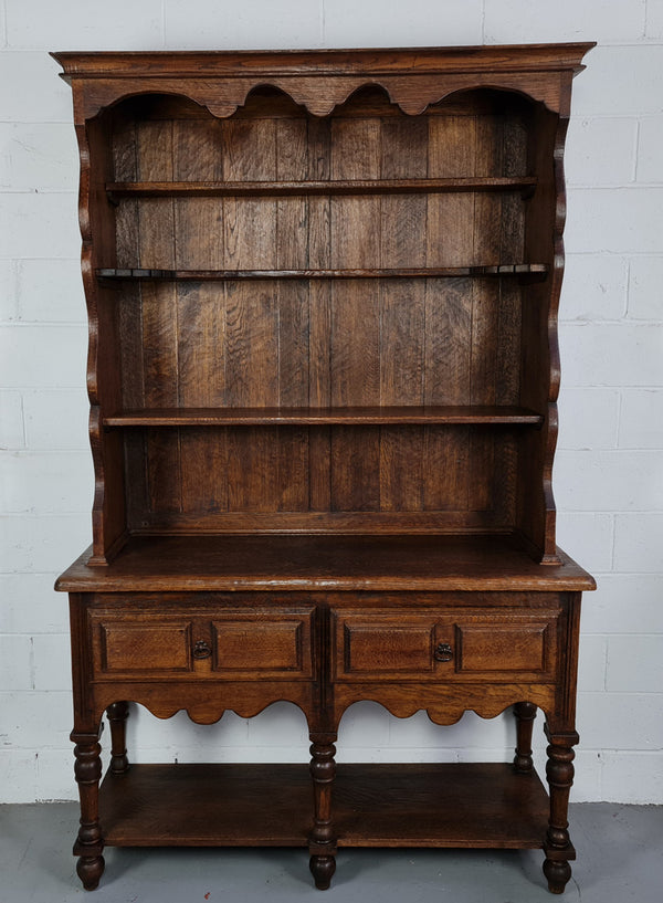 Rustic French Oak three shelf and two drawer kitchen dresser of pleasing small protions. Comes apart into two pieces for transport making it ideal for an apartment or unit. In very good original detailed condition.