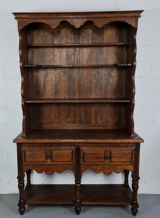 Rustic French Oak three shelf and two drawer kitchen dresser of pleasing small protions. Comes apart into two pieces for transport making it ideal for an apartment or unit. In very good original detailed condition.