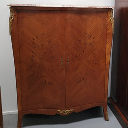 French Louis 15th style Kingwood marquetry inlaid two door cupboard with a beautiful marble top. It has three adjustable shelves and decorative ormolu trim. It has been sourced from France and is in good original detailed condition.